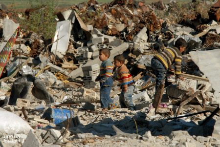 15 Boys salvaging a destroyed building in the Gaza Strip