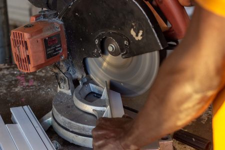 Glazier cutting and installing glass in Northern Nigeria (30)