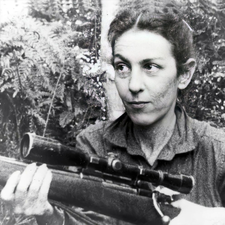 Celia Sánchez with a scoped rifle